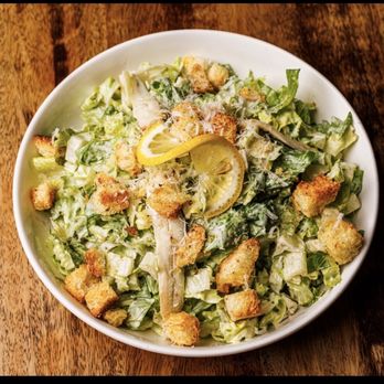 Crisp Rochester signature dishes Crispy Chicken Caesar Salad, Southwest Salad, Custom Salads and Wraps